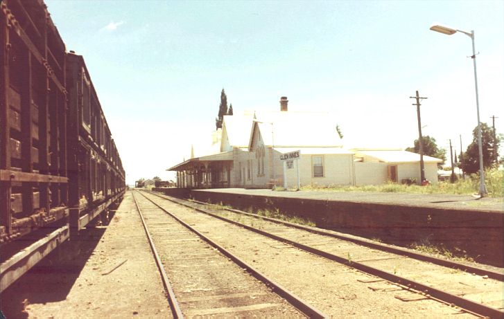 
A line of wagons sit in the siding opposite the station.  This siding
has since been removed.
