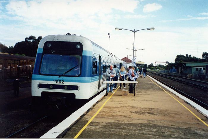 
An Xplorer set sits in the platform.  The number of people on the platform
is explained by the fact that Countrylink was having a sausage sizzle
to announce the commencement of the new Xplorer weekly service commencing
the following day.
