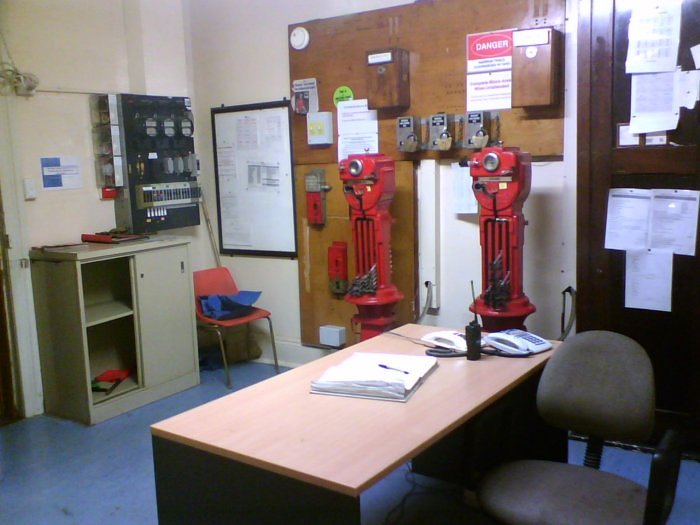 The interior of the station master's office, showing the staff machines for the next and previous sections.