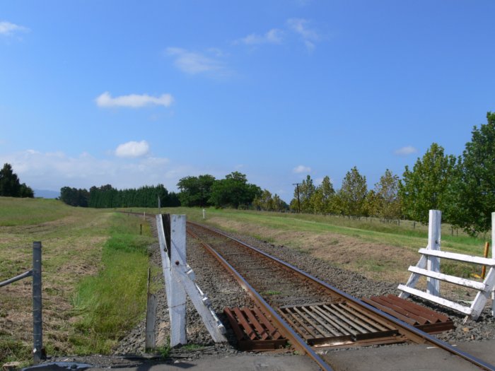 The view looking north.  The former station was on the right hand side of the line, with a short goods siding opposite.
