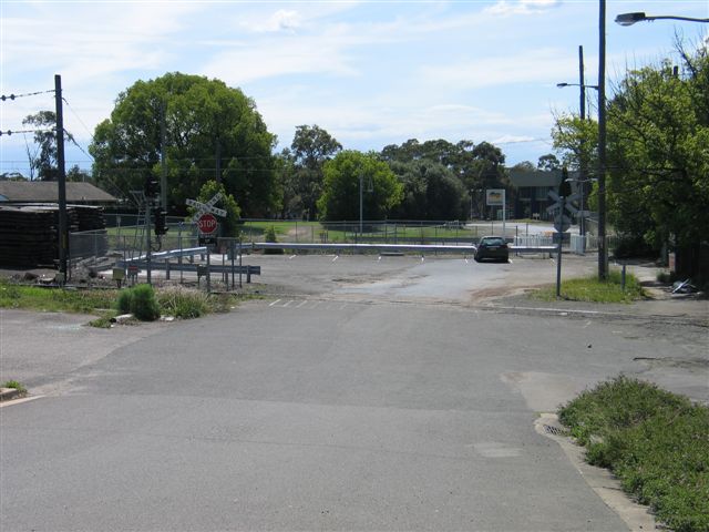 
The view looking towards the road-side entrace to the station.  The level
crossing in the foreground is the goods branch to Sandown.
