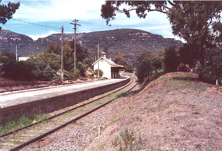
The view along the well-maintained curved platform with intact station
building.
