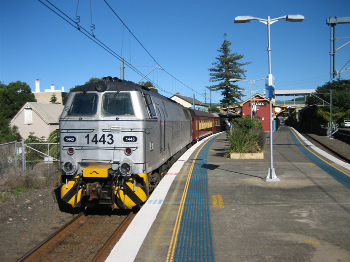 Kiama station with Independent Rail Australia loco 1443 in charge of a tour train standing on platform 2 facing north.