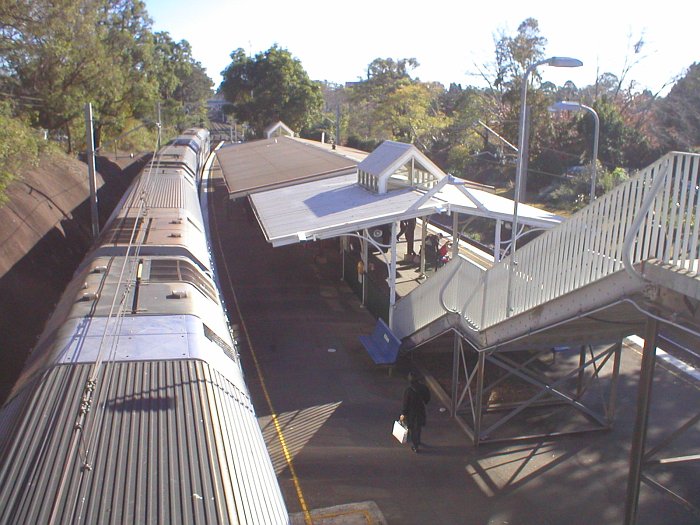 The view looking along platform 2 with a Hornsby-bound service adjacent.