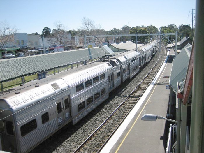 The view from the pedestrian overbridge looking north. Platform 1 (City services) is on the right, Platform 2 (terminating services from the city) is occupied by a suburban K set, Platform 3 (Hornsby services) is on the other side of the K set.