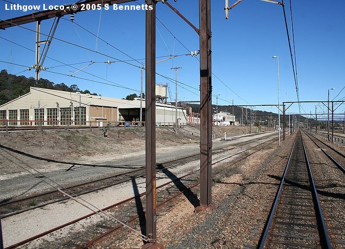 A view of Lithgow Loco from a down train to Lithgow. The structure behind the left staunchion is the old sanding building with the reservoirs on the roof.