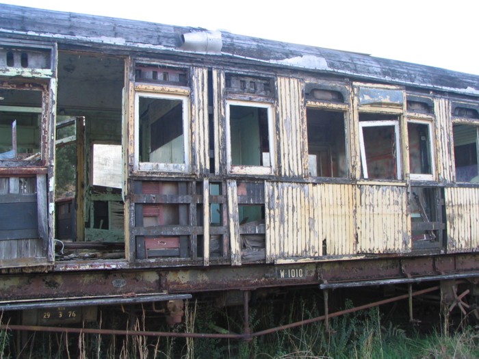 A close up view of a decaying carriage.
