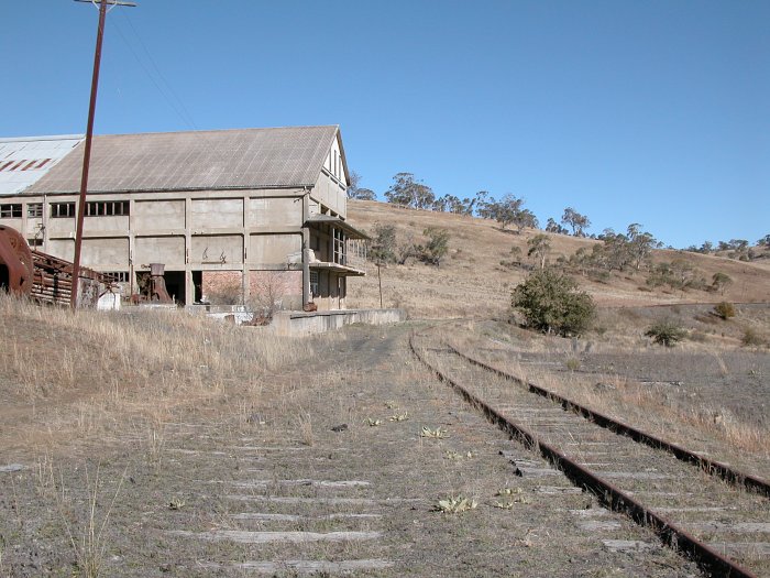 The view looking south-west towards the meatworks. The former siding has been lifted although many of the sleepers remain.