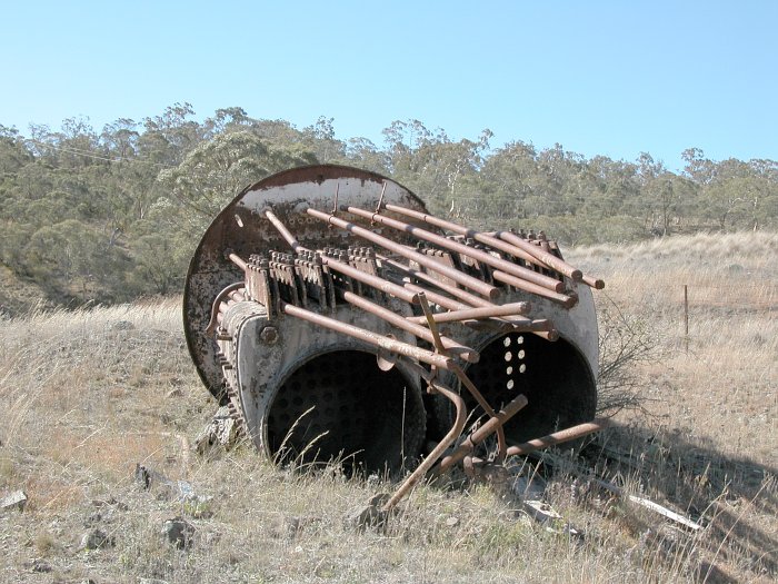 The remains of a steam engine boiler, part of a collection of pumping equipment ruins.