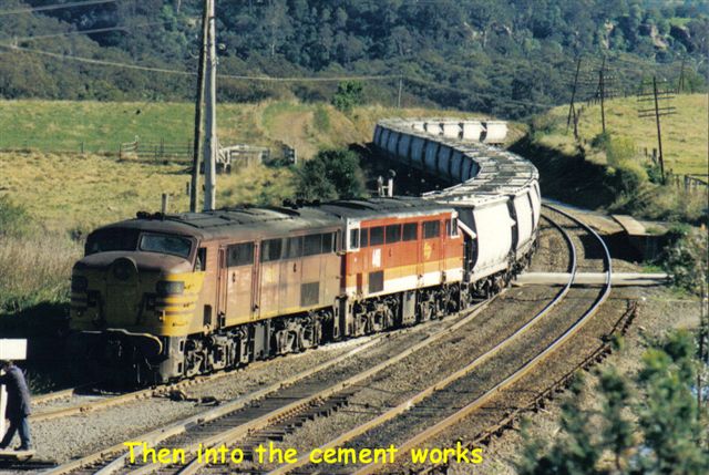 The Up train is now moving forward from the down main onto the cement works siding.