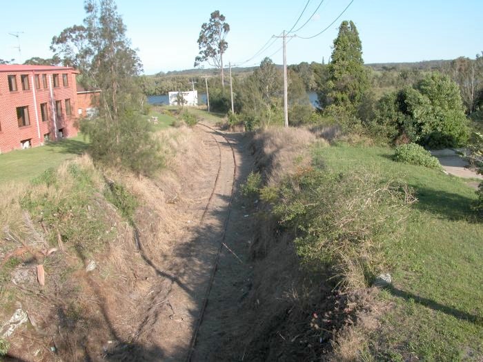 This view is taken from the highway bridge looking towards the Manning River. The Dairy Farmers Factory is to the left.