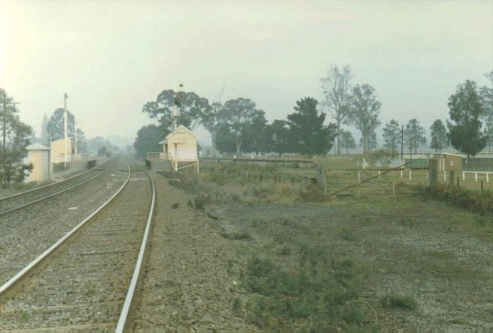 
The view looking south to Menangle Park station.  The one-time
Racecourse Sidings left the main line here and proceeded through the
gate (which was normally closed on non-race days).
