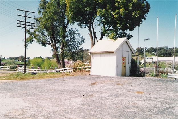 A shed at the down end of the station. Note the crossing gates on the left hand side.