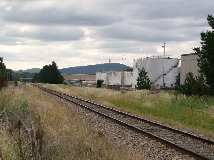 The view looking west at Molonglo. Beyond the grass is the North Shunting Road, serving a number of oil terminals.