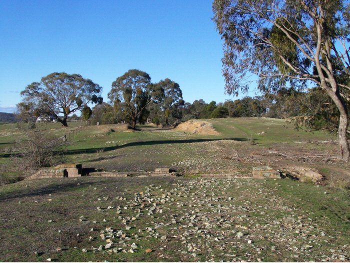 The view looking along the former formation towards Sydney, showing a the remains of a brick culvert.