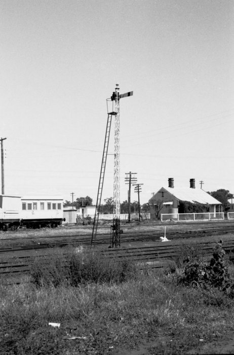 A semaphore signal sits in the yard.
