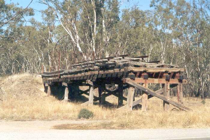 
Newell Highway bridge, the southern abutment.  The track that must have
originally crossed the highway has been removed and placed on top of track
on the southern side.
