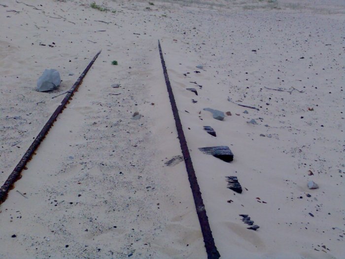 Some rusted tracks exposed in the shifting sand dunes leading towards Nobby’s Head.