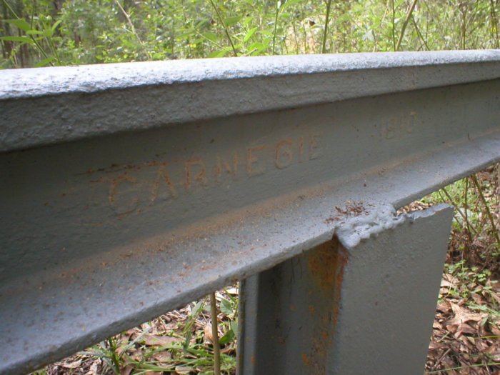 While most of the railway track was lifted and sent to England to build tank barriers, some of the remnants have been used by National Parks to build barriers. This piece of rail is marked “Carnegie 1910”.