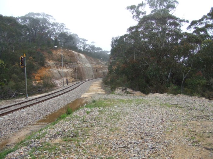 The view looking south from the former station location. Behind the camera are the former branch to Newnes and the former Dargans deviation. The visible track is the modern balloon loop serving Clarence Colliery.