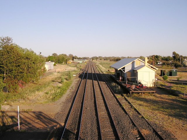 The view looking west from the footbridge, showing the goods shed. The turntable is located on the siding the branches off in the middle distance.
