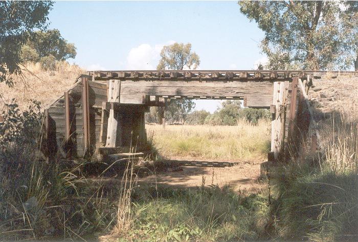 A small timber bridge over a culvert situated between Brocklesby and Burrumbuttock, approximately 4 kilometres east of Brocklesby.