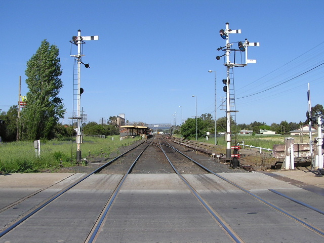 The view looking east from the Newell Highway level crossing, towards the western end of station.