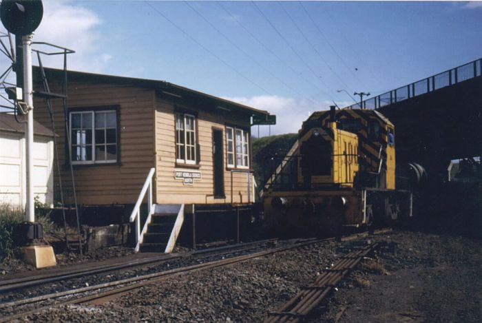 Port Kembla North signal box was a busy location using levers.  In front of the box is an Lysaght locomotive shunting the sidings. 