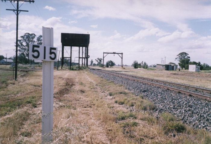 
The view looking north of the 515 km post, elevatated water tank and
gantry crane.  The one-time station was located at the near siding of
the tank.
