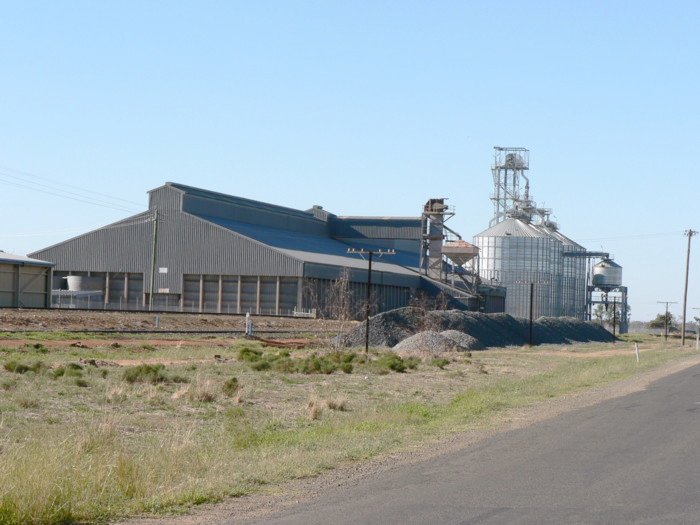 The large silo complex adjacent to the main line.