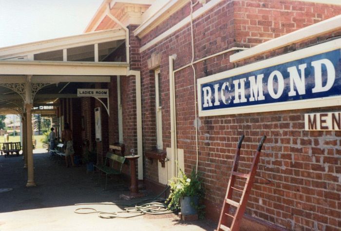 
The station building and nameboard.
