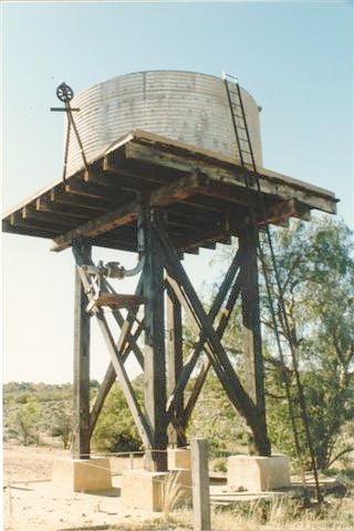 A closer view of the small elevated water tank.