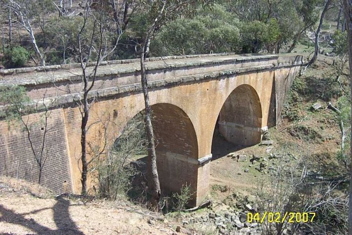 The 4th crossing of Solitary Creek, a twin arch brick bridge.