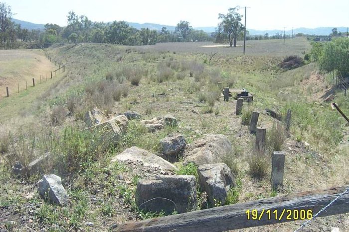 The formation of the Muswellbrook No 2 Colliery branch curves away form the main line (just out of shot on the right). The bridge over Muscle Creek  is visible in the right distance.