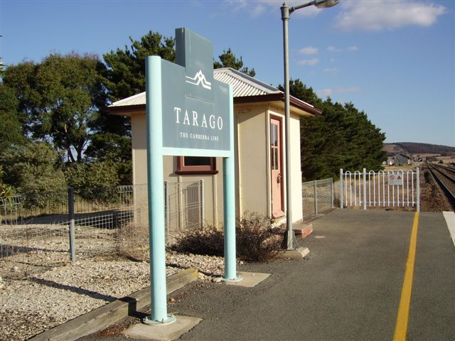 The Countrylink nameboard and signal box at the Canberra end of the platform.