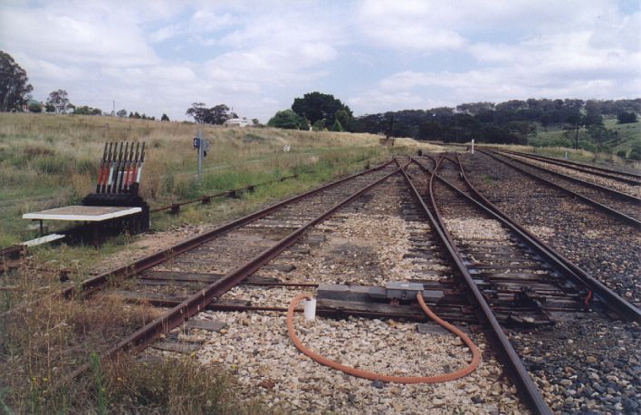 
The remains of the yard.  A couple of tracks are still used as Perway
Sidings.  The line to the left of the short white post in the distance is
the beginning of the branch line to Oberon.
