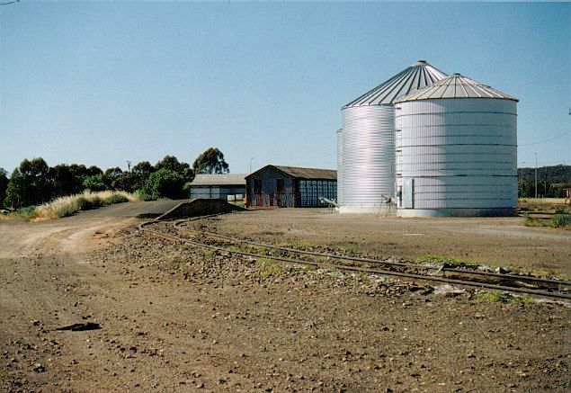 
A view looking towards Cootamundra, showing a loading bank, silos and possibly
a grain shed.
