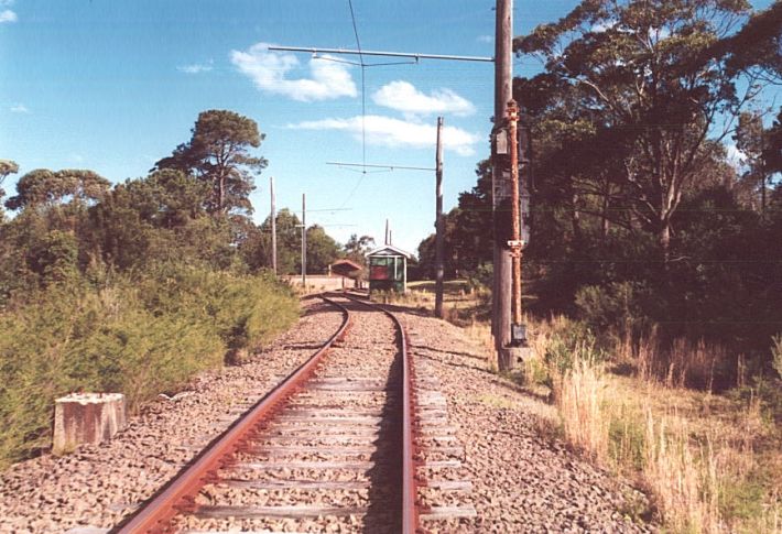 
The approach to the station.  In the original layout, the platform was
directly behind the box, with two sidings to the right and three
to the right.  The concrete base on the left was for Frame B, and is a
relic of the original yard.
