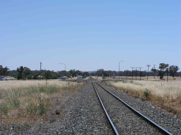 
The view looking north towards Parkes.  The one-time station was on the
right hand side of the track in the foreground.

