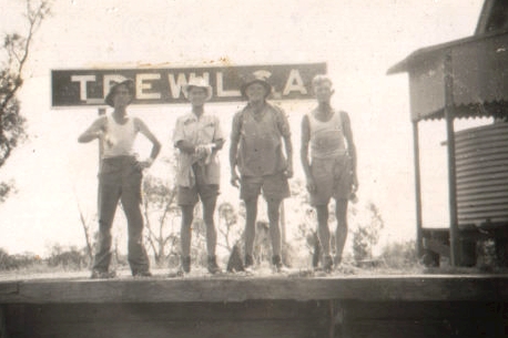 Workers pose in front of the sign board on the platform.