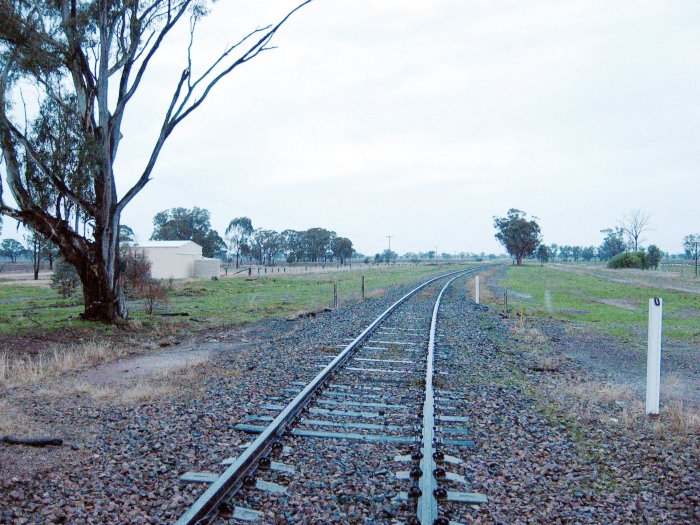The view looking south.  The one-time station was on the right of the main line in the distance.