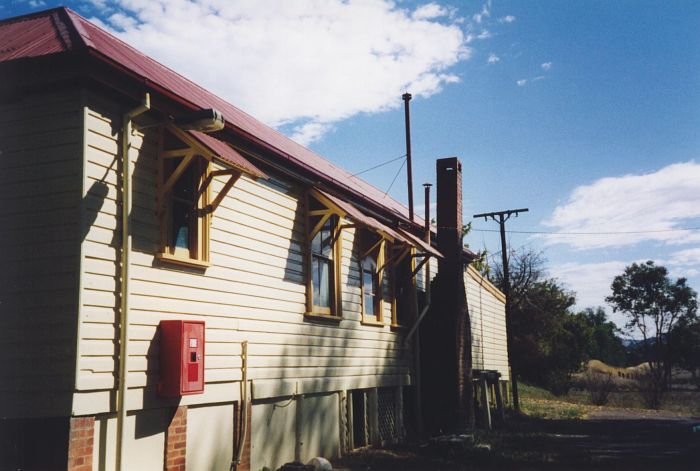 
The road side view of the station building.  Beyond the chimney is the remains
of the small loading platform for goods and parcels, made out of sleepers.
