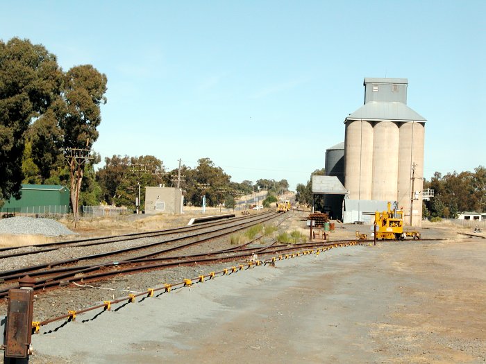 The view looking south towards the station. Yellow perway vehicles can be seen in the loop and silo sidings.