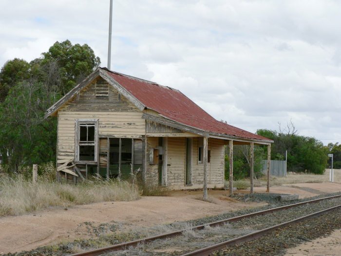 The view looking east of the rotting station building.