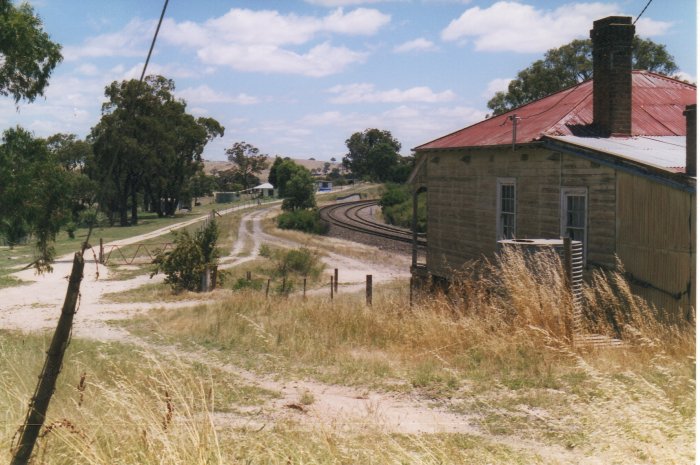 Site of Wambool Station looking down the line towards Bathurst, showing station master's house and distant loading bank.