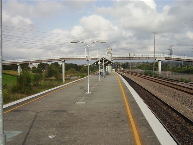 Warabrook Station looking east illustrating the expansive footbridge. The left hand approach services the the suburb and light industrial area of Warabrook. The right hand ramp leads to the walking path to Newcastle University.