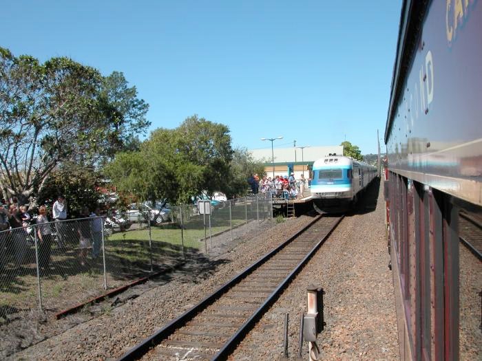 A Sydney bound XPT in the platform crosses a north bound tour train in the loop at Wauchope.
