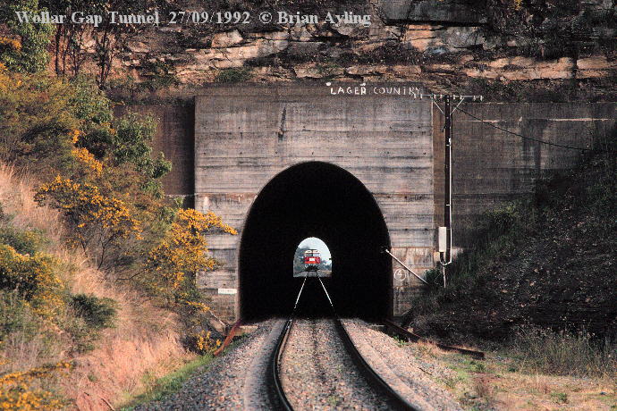 Looking through Wollar Gap Tunnel from the east, with an up train approaching.