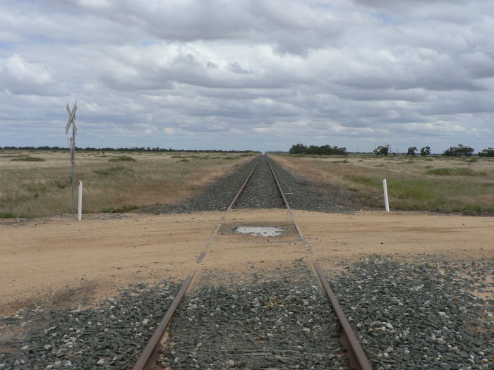 The view looking west beyond the level crossing.