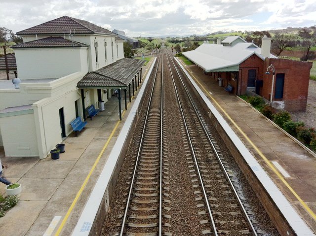 The view of Yass Junction looking from the pedestrian bridge over both platforms, down the line (away from Goulburn).